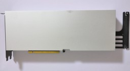 Teardown photograph of an NVIDIA CMP 170HX accelerator card showing the bare GA100 die and the row of HBM2e memory stacks beneath a large passive heatsink