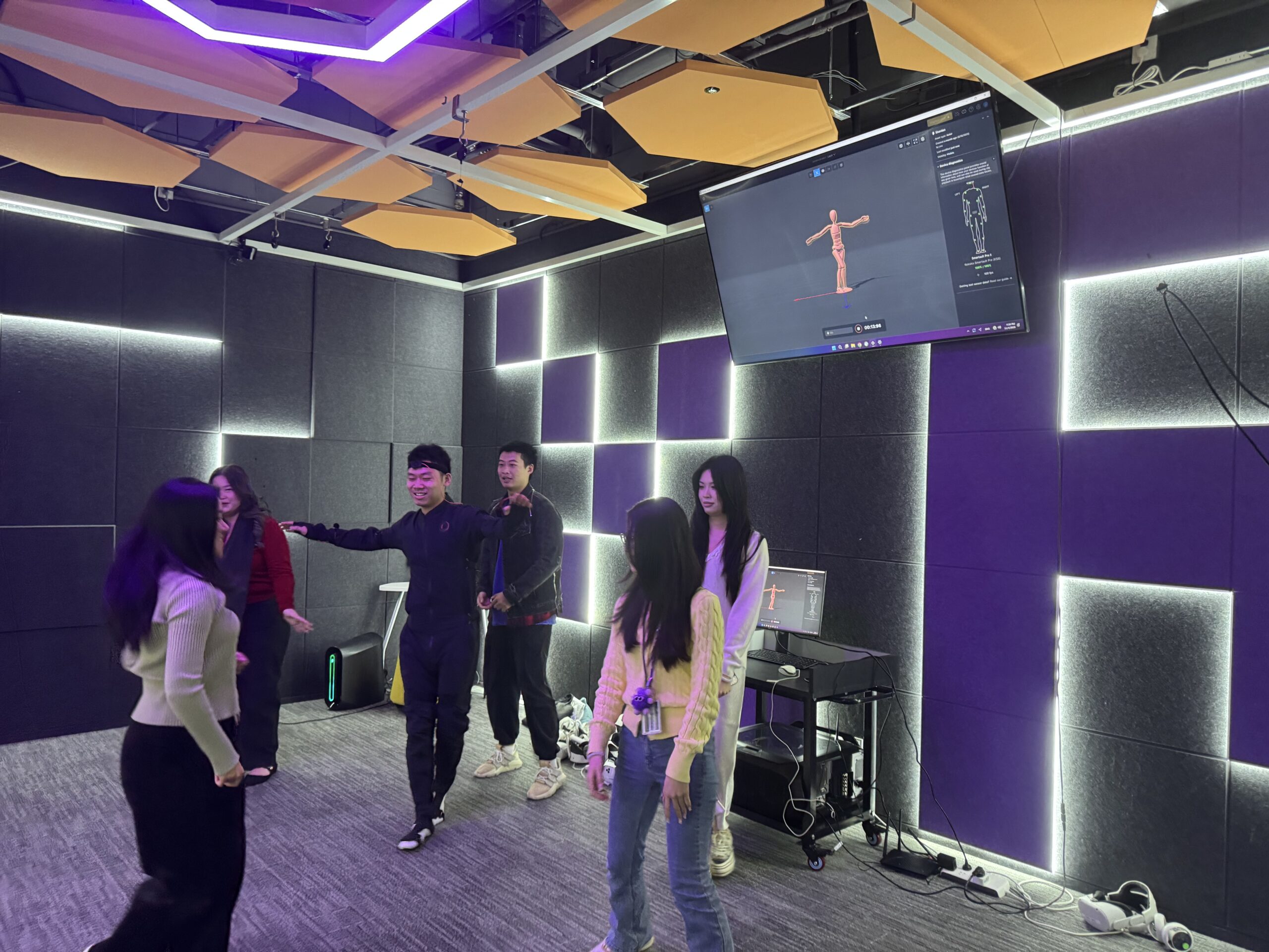 students dancing with mocap suit