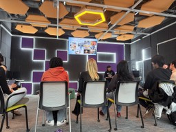 students and professor in lecture talking about VR Hajj